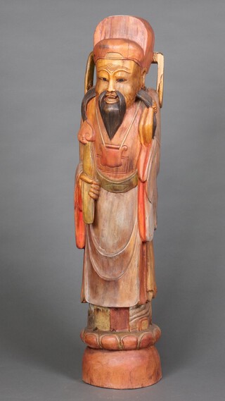 A carved hardwood figure of a standing sage 106cm h x 25cm w 