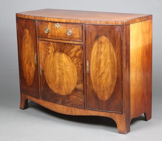 An Edwardian crossbanded mahogany bow front sideboard fitted a drawer above cupboard, flanked by panelled doors, raised on bracket feet 95cm h x 122cm w x 55cm d 