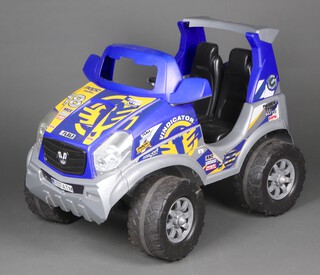 A child's battery operated car 82cm h x 99cm l x 60cm w 