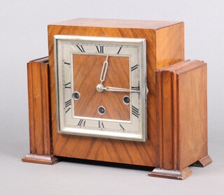 A 1930's chiming mantel clock contained in a walnut case 21cm h x 27cm w x 11cm d 