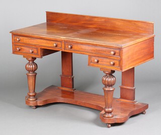 A Victorian mahogany dressing table with raised back and 4 drawers, on turned and fluted supports 87cm h x 127cm w x 56cm d (water and contact marks in places)