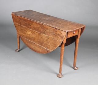 A Georgian oak oval drop flap tea table, fitted a frieze drawer, raised on club supports 69cm h x 121cm w x 40cm (split to top, damage to rule joint) 