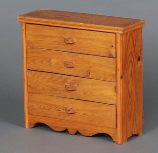 A miniature pine chest of 4 drawers 35cm h x 37cm w x 13cm d -