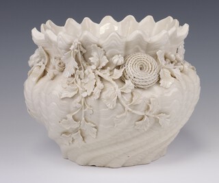 A white glazed Belleek jardiniere decorated with scrolling flowers, black mark to base 23cm 