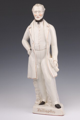 A Victorian Staffordshire figure of a standing Wellington holding a letter in his left hand 41cm 