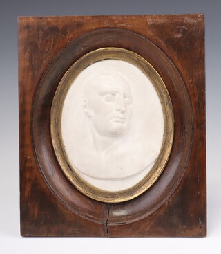 A 19th Century Parian death mask of Napoleon in semi profile, oval, in gilt slip with walnut frame 15cm x 11.5cm 