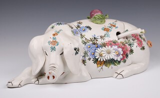 A mid-Century painted porcelain tureen, with ladle, in the form of a sleeping pig, decorated with flowers 53cm 