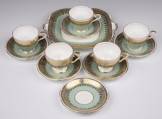 An Aynsley tea set comprising 5 cups, 6 saucers and a sandwich plate with pale turquoise and gilt ground 