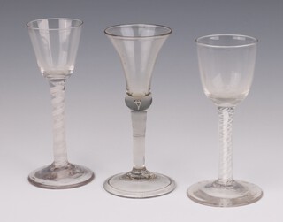 A Georgian cordial with white twist stem 16cm, a ditto 15cm and a flared neck cordial 16cm 