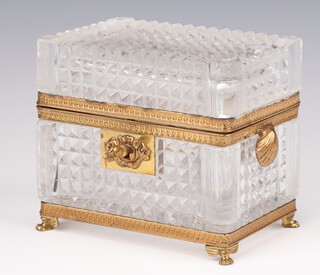 A 20th Century French cut glass rectangular trinket box with key and gilt metal shell mounts, raised on paw feet 11.5cm 