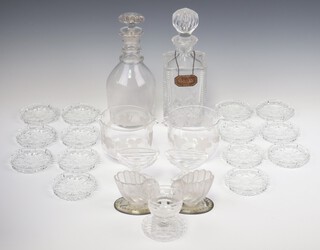 A pair of 19th Century glass rinsers decorated with vines and leaves 9cm (chipped), 2 decanters, 1 with a silver label, 2 shell shaped salts (both chipped), 5 table salts (1 chipped), an ashtray (chipped) and 15 moulded dishes/coasters 