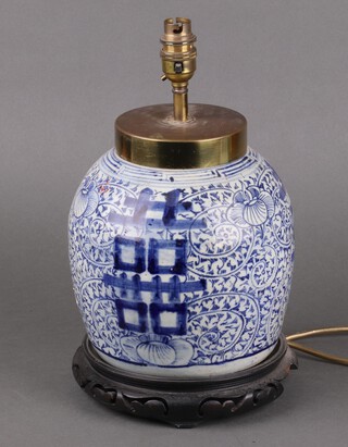 A Chinese Provincial blue and white ginger jar decorated with Mon and scrolling flowers, with brass mounts, on a wooden stand (a/f), converted to a table lamp 24cm  