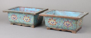 A pair of 19th Century Chinese turquoise ground and floral enamelled planters of rectangular shape, raised on panelled supports 10cm h x 25cm w x 18cm d 