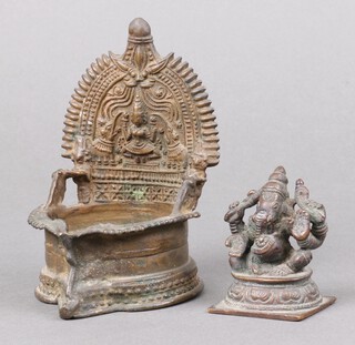 A 19th Century Indian bronze figure of Ganesh, raised on a square base 7cm x 5cm x 4cm, together with an Indian bronze throne stand 11cm x 8cm 