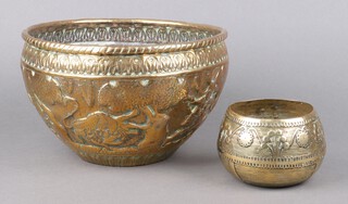 An Indian circular embossed brass jardiniere decorated hunting scene 15cm x 24cm, an Indian cast polished bronze bowl decorated stylised trees 8cm x 10cm 
