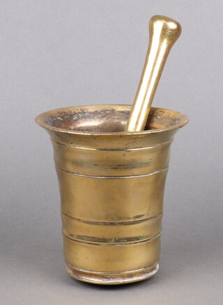 A 17th Century bell metal mortar 15cm x 15cm together with an associated pestle 26cm 