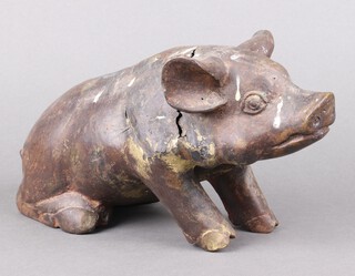 A 19th Century bronze figure of a seated pig 18cm x 33cm x 12cm 