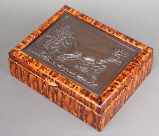 A 20th Century American figured "walnut" trinket box the lid inset a bronzed plaque depicting a leaping stag 10cm x 31cm x 25cm 