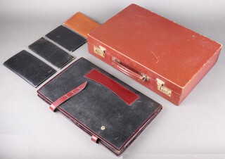An Asprey brown leather combination briefcase 10cm x 46cm x 31cm (combination 333),  an Asprey snake skin wallet and ditto cheque book holder/wallet both with 10th 9ct gold mounts, an Asprey black leather travel wallet and a leather wallet with silver mounts 