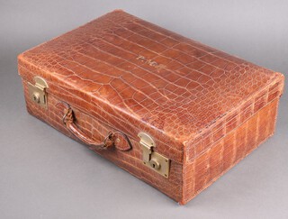 A brown crocodile suitcase with gilt metal mounts 16cm x 55cm x 37cm 