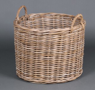 A circular woven willow twin handled log basket 50cm h x 66cm 