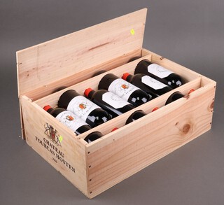 Twelve bottles of 2009 Chateau Fourcas Hosten red wine 