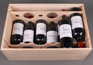 Eight bottles of 2009 Chateau Lagrange Grand Cru Classe St Julien-Medoc 