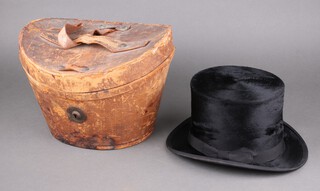 A gentleman's black top hat marked Superfine Made in England London, size 7 1/4, complete with leather carrying case 