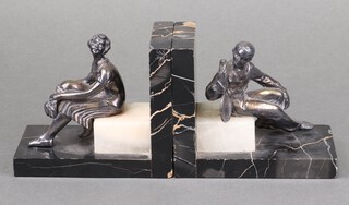 A pair of 1930s chrome figures of tennis players ( possibly Bill Tilden and Helen Wills Moody? ) seated on marble bookends 12cm x 27cm 