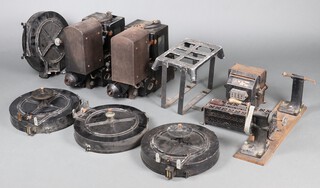 A pair of 35mm Holmes Educator Model Portable Sound on Film projectors, one no.9362 Type 9, the other no.12042, together with 4 film magazines, Celec slide dimmer, power supply, mains switch power supplies, hand rewinder and other accessories 
