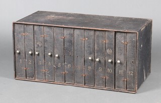 A metal 35mm film filing cabinet by Premier with 12 spring loaded compartments (3 missing knobs) 41cm h x 85cm w x 41cm d 