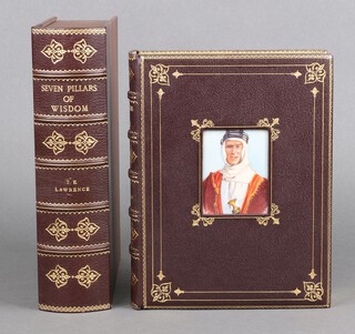 Lawrence T.E. - "Seven Pillars of Wisdom", 1st Trade Edition Jonathan Cape London 1935, bound for Asprey in gilt and brown Morocco, with inlaid hand painted portrait of Lawrence to cover, illustrated throughout with charcoal/line drawings and pull out maps, contained in half bound gilt and brown Morocco faux plush lined book casing, 4to