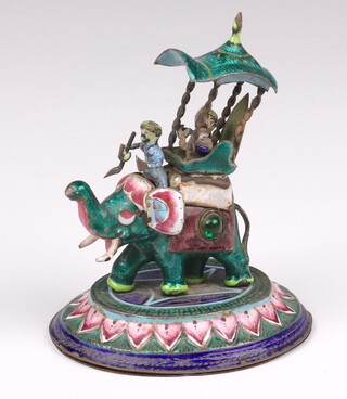 An Indian enamelled silver model of an elephant with driver and rider with inlaid mother of pearl and paste stones, 9cm, 119 grams 