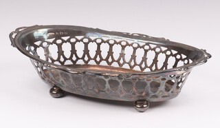 An oval silver pierced dish on ball feet Birmingham 1931, maker Britton Gould and Co., 18cm, 94 grams 