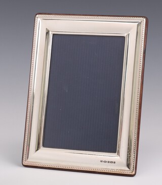 A rectangular 925 standard silver photograph frame with beaded decoration 20cm x 15cm 