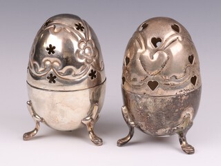 A pair of contemporary silver plated pierced egg shaped pot pourri on pad feet 12cm