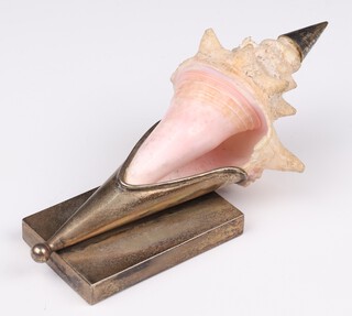 A silver plated mounted shell paperweight on a rectangular base 17cm 