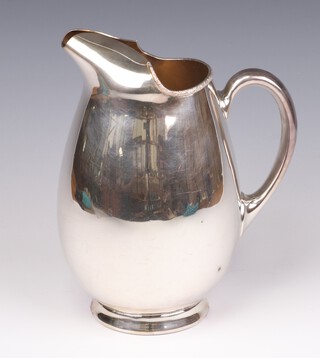 A stylish silver plated water jug marked Harrods 22cm 