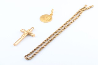 A 9ct yellow gold part chain 15cm, 1.8 grams, a 14ct yellow gold cross 0.5 grams and an 18ct yellow gold charm 0.9 grams 