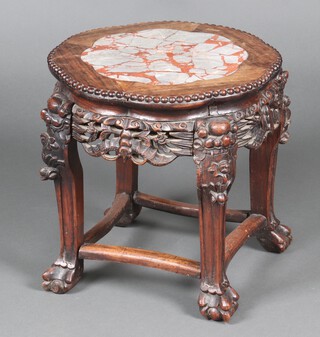 A 19th Century circular carved and pierced rosewood jardiniere stand with pink veined marble inset top, raised on carved supports 45cm x 44cm diam. 