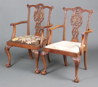 A pair of carved mahogany Chippendale style open armchairs with upholstered drop in seats, raised on cabriole supports 100cm h x 59cm w x 49cm (seats 28cm x 28cm) 