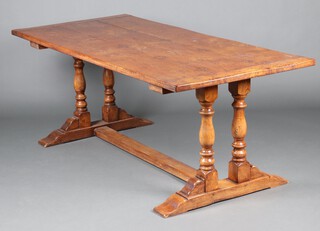 A 17th Century style elm refectory dining table, the top formed of 3 planks, raised on 4 turned columns with H framed stretcher 76cm h x 91cm w x 198cm l 