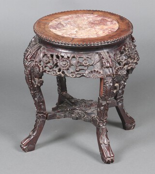 A 19th Century circular Chinese carved and pierced rosewood jardiniere stand with peach veined marble top 50cm h x 38cm diam.  