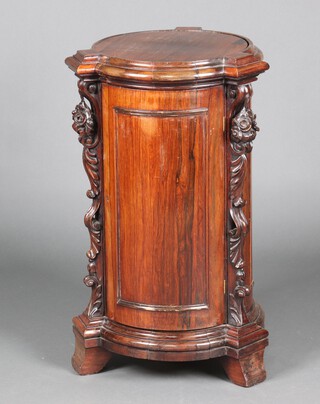 A 19th Century Continental rosewood free standing pedestal cabinet with revolving top and pierced carved floral columns to the side, the shelved interior enclosed by a panelled door 80cm h x 47cm diam. 