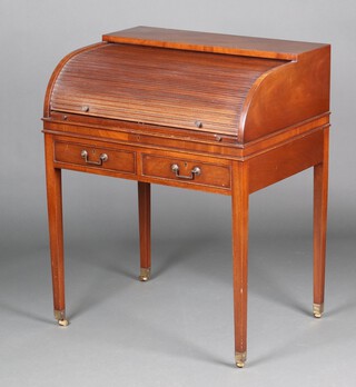 A Georgian style mahogany cylinder bureau with tambour shutter, the interior fitted shelves, drawers and pigeon holes, the base fitted 2 short drawers, raised on square tapered supports, brass caps and casters 95cm h x 76cm w x 56cm d 