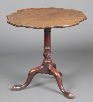 A 19th Century Chippendale style circular snap top tea table with bracketed border raised on turned column and tripod base 70cm h x 76cm diam.  