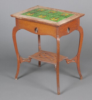A Liberty style Art and Crafts bleached oak rectangular occasional table, the top inlaid 6 polychrome glazed tiles depicting mushrooms and acorns, having a pierced apron and rectangular undertier, raised on cabriole supports 73cm h x 60cm w x 38cm d 