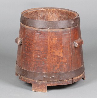 A coopered oak twin handled barrel planter/kindling box of waisted form 42cm x 35cm 