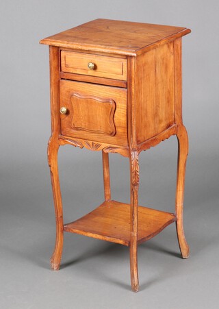 A French elm bedside cabinet fitted a drawer above panelled door and undertier, raised on cabriole supports 84cm h x 37cm w x 37cm d 