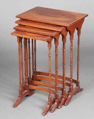 A nest of 4 Georgian style rectangular mahogany coffee tables, raised on turned supports, the largest 71cm h x 50cm x 35cm d, the smallest 64cm h x 32cm w x 28cm d   